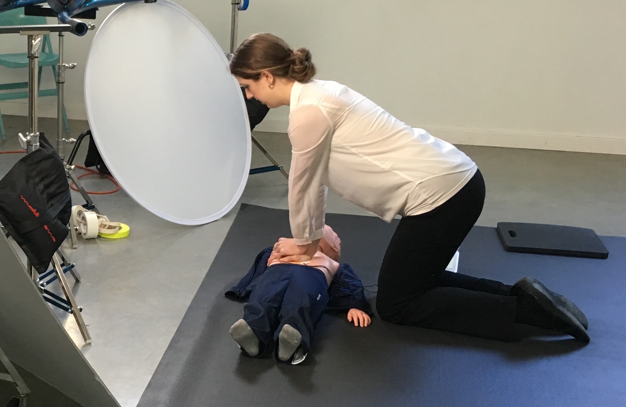 Julie performing CPR on a dummy for a user simulation