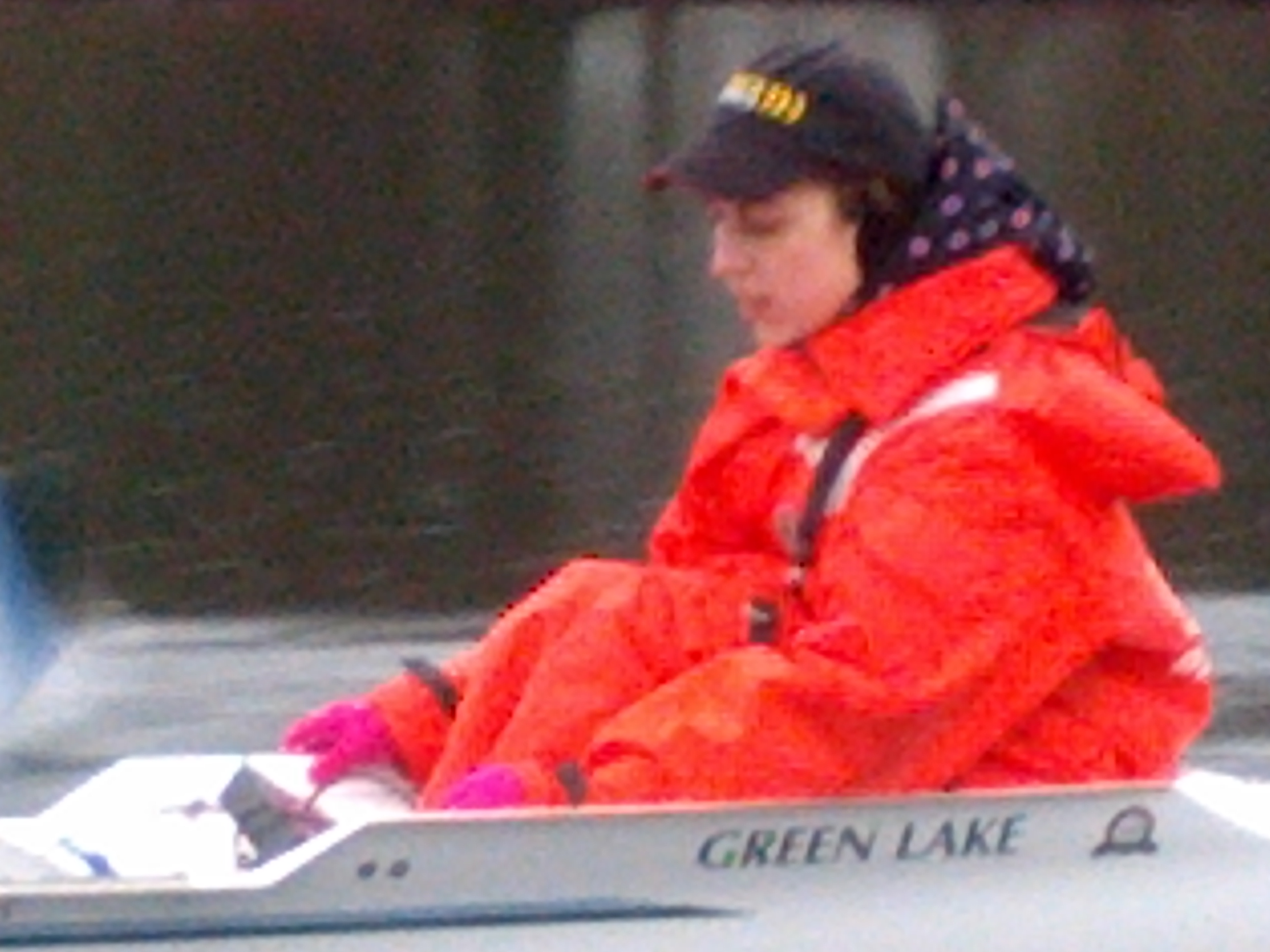 closeup of Julie steering a boat